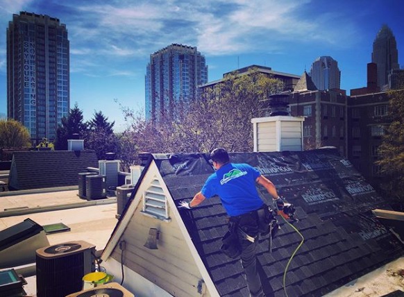 Residential roofer performing roof repairs in Charlotte, NC