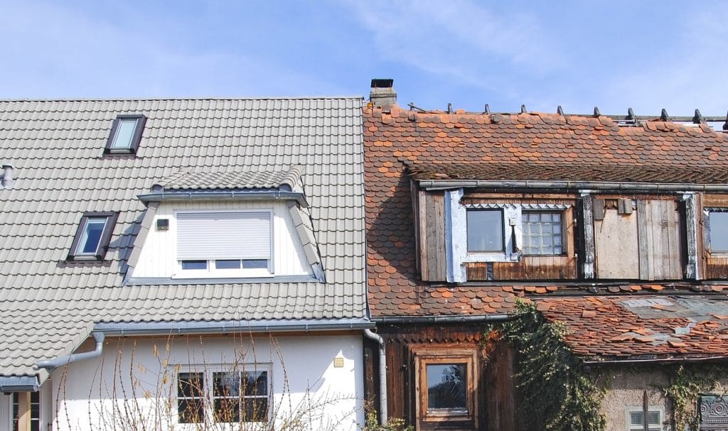 Picture showing new and old roof side by side to highlight the lifespan of roof materials