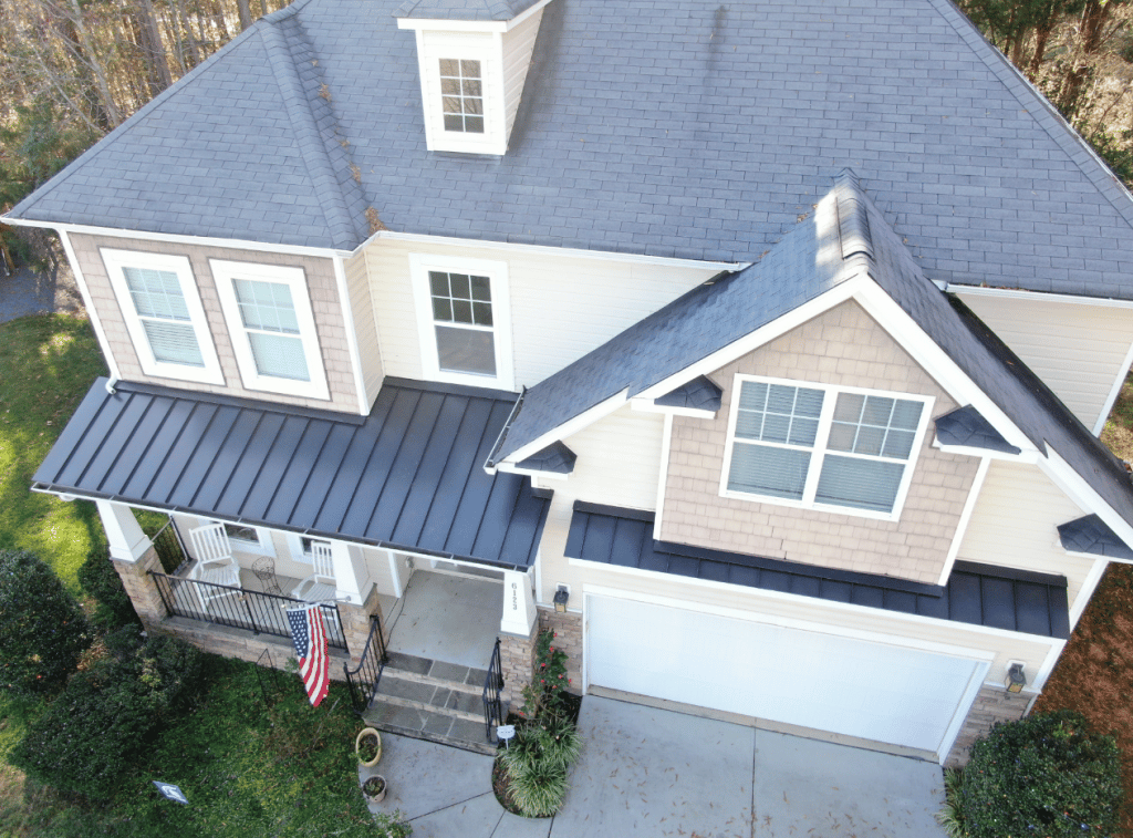 Suburban home with a recently serviced metal roofing section