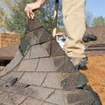 Worker Removing Old Roof Shingles for Replacement