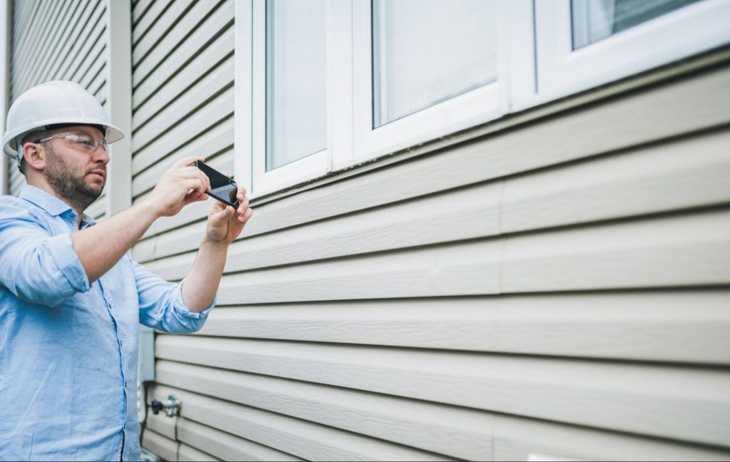 worker-installing-residential-house-siding