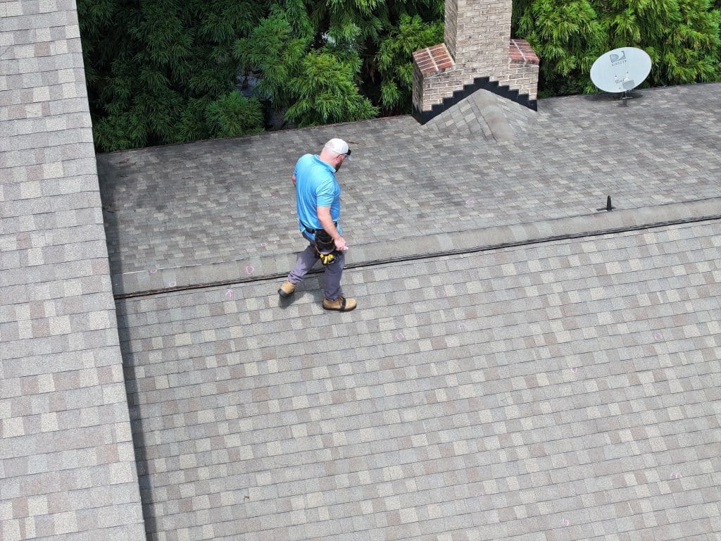 signature-exteriors-worker-conducting-residential-roof-inspection