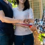 couple-shaking-hands-with-contractor