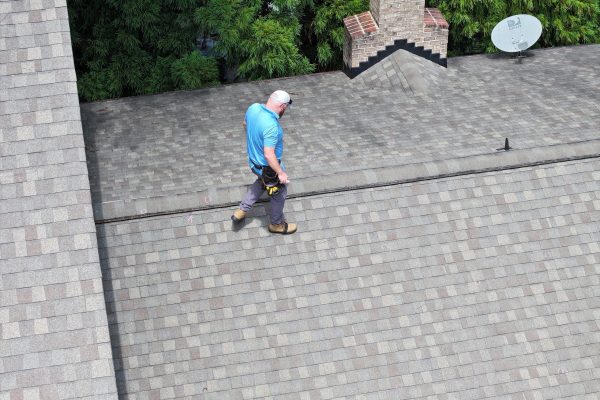 signature-exteriors-worker-conducting-residential-roof-inspection