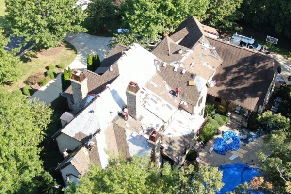 action-shot-of-roofers-completing-residential-roofing-services